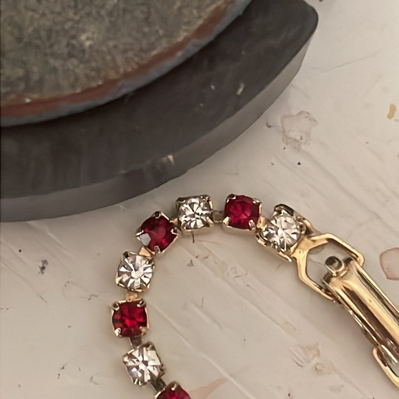 7.5” gold plated tennis bracelet with 38 prong set red and clear crystals - Picture 13 of 15